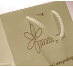 Promotional paper bags with slot for ribbons